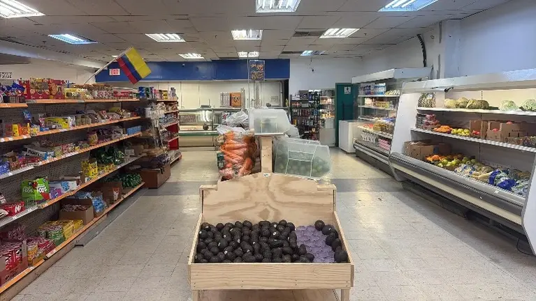  Produce and grocery section with display shelving included in the sale.