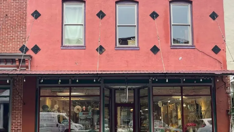 High-visibility corner location with heavy foot traffic during town festivals.