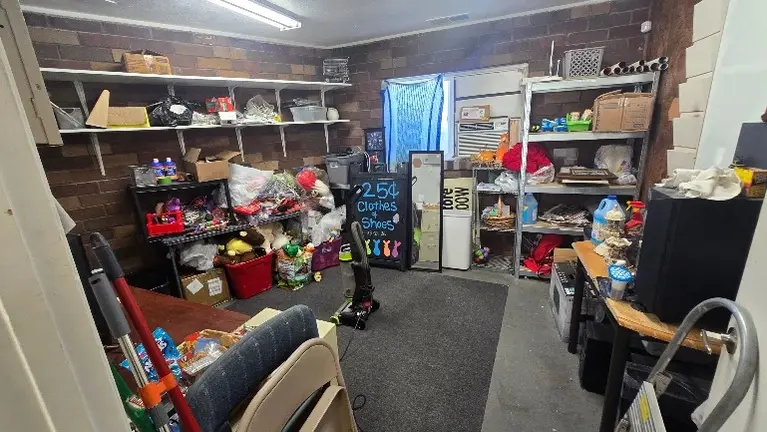 Additional back room used for storage, essential products, and operational supplies. can also serve as a break area or expanded inventory space