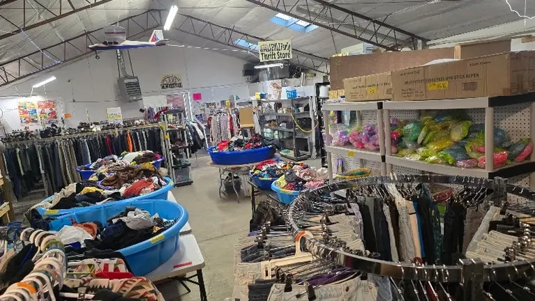Large, fully stocked thrift store layout designed for high-volume sales and easy customer navigation. 