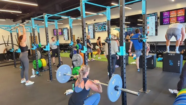 Full studio in action, showcasing coach-led group training and strong member engagement