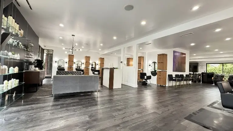 Ready for immediate, day-one operation. Sale includes premium styling stations, modern shampoo bowls, color bar, furniture, and retail shelving.