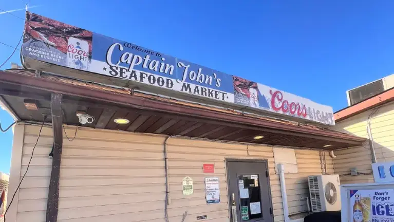 Front of building with Captain John's sign