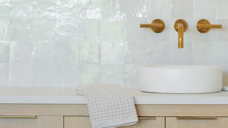 Designer sink with Concretti basin, Restoration Hardware wall-mounted faucet, and handcrafted Moroccan zellige tile