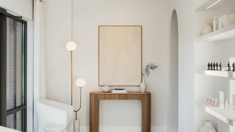 Light-filled lobby with illuminated display shelving and welcoming seating area