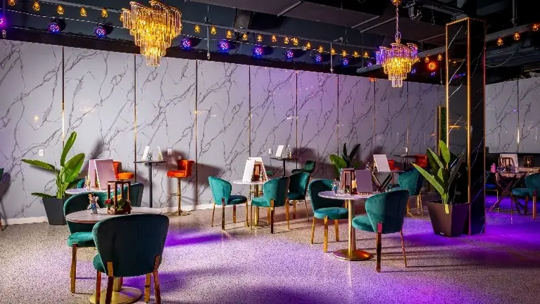 Spacious Open Layout Featuring Marble Walls, Designer Lighting, and Elegant Chandeliers