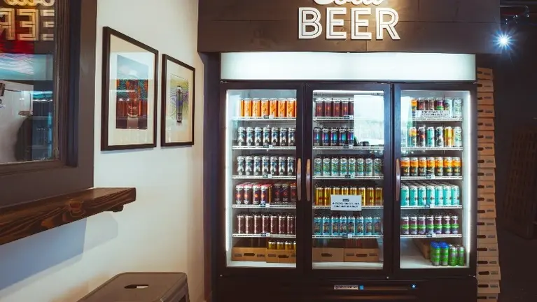 Walk-in cooler and retail display setup supporting on-site and to-go sales.