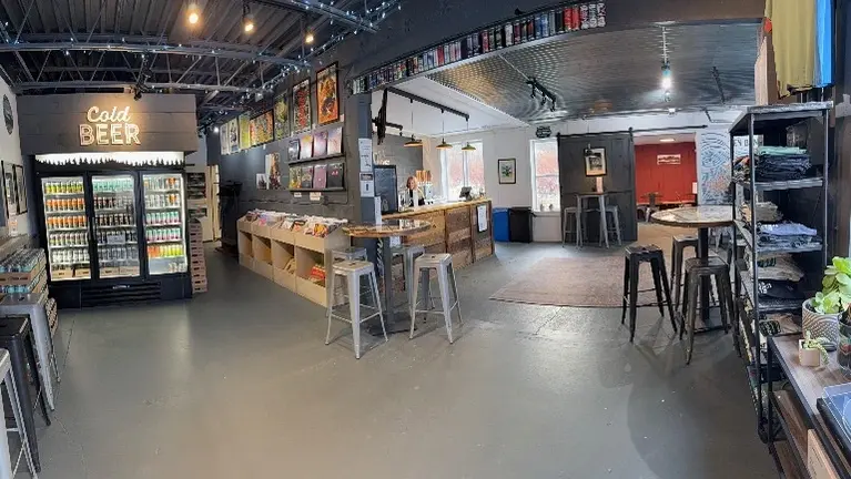 Open layout connecting taproom, retail, and cold storage, designed for efficient customer flow.