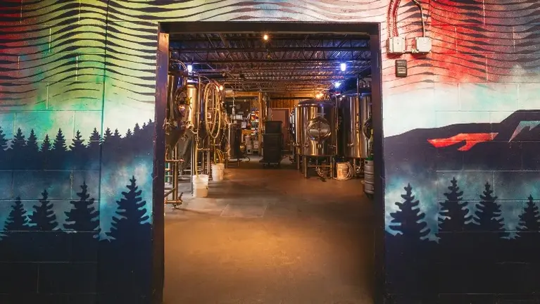 Production area with fermentation tanks and brewhouse infrastructure in place.