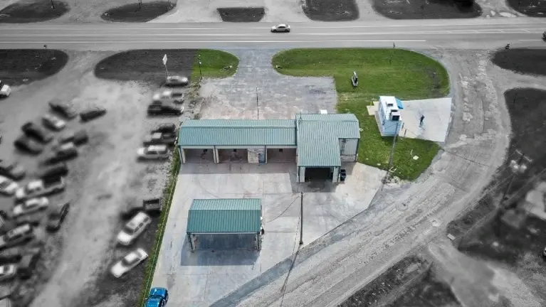 Aerial view of carwash and ice-filtered water lease space. Aerial view of carwash and ice-filtered water lease space.