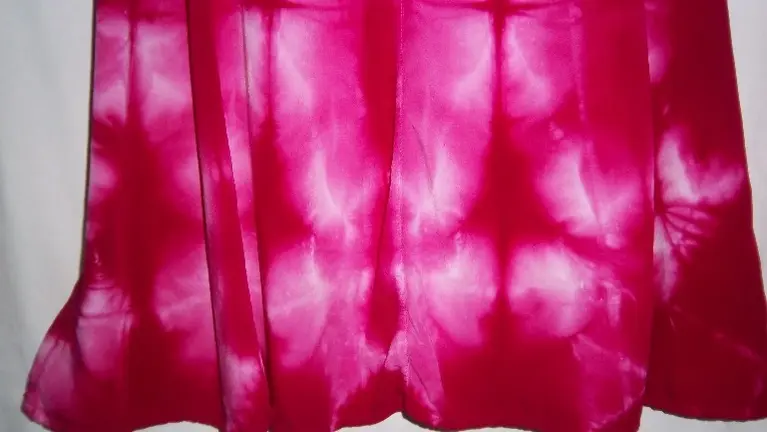 This is a detail of a knee lengh rayon dress.  It ties in back to self-adjust.  A big seller, dress