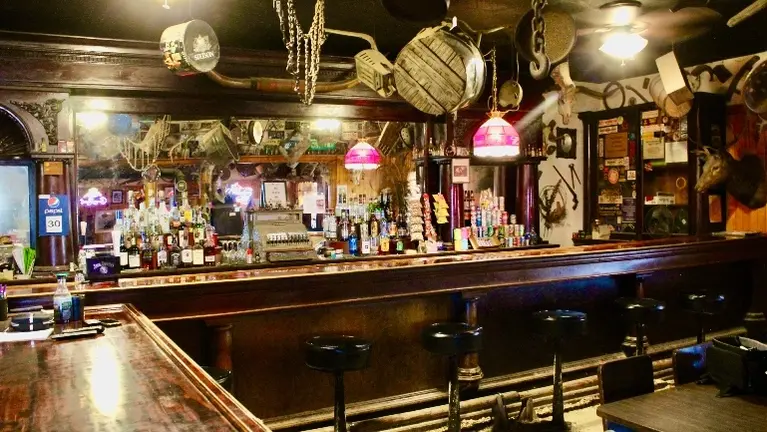 Main bar is packed with antiques, humor and interesting items.