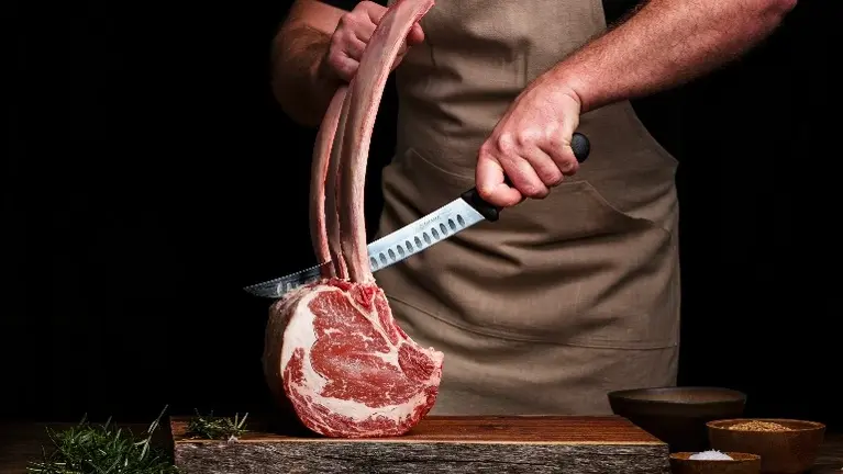 butcher carving meat butcher carving meat