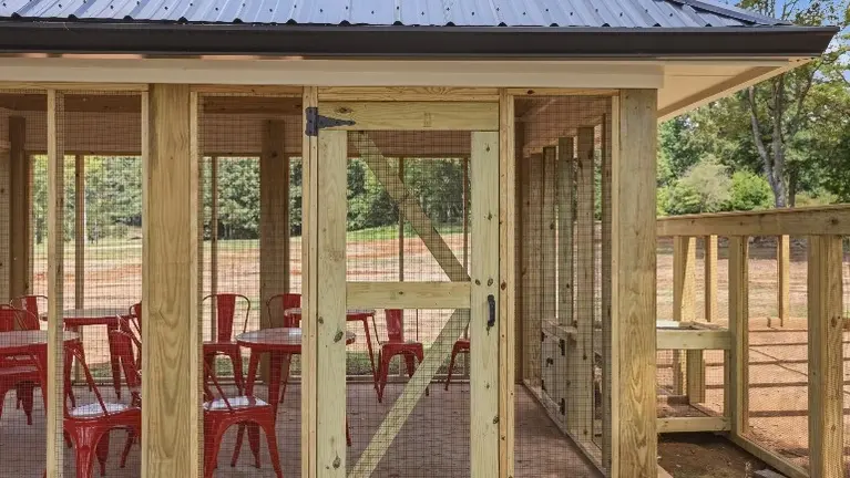 The custom-built chicken coop and aviary sets the stage for the farm's signature Clucktails experience, giving guests a one-of-a-kind attraction all their own. The custom-built chicken coop and aviary sets the stage for the farm's signature Clucktails experience, giving guests a one-of-a-kind attraction all their own.
