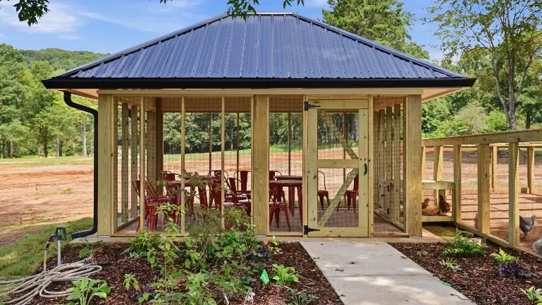 The custom-built chicken coop and aviary sets the stage for the farm's signature Clucktails experience, giving guests a one-of-a-kind attraction all their own. The custom-built chicken coop and aviary sets the stage for the farm's signature Clucktails experience, giving guests a one-of-a-kind attraction all their own.
