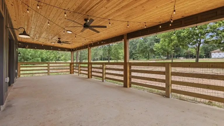 The custom barn offers a versatile space for farm experiences and gatherings, complete with a maintenance shop and stables built right in. The custom barn offers a versatile space for farm experiences and gatherings, complete with a maintenance shop and stables built right in.
