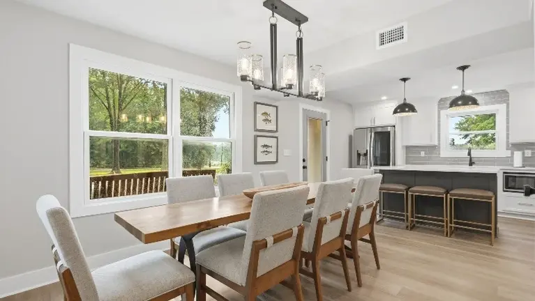 The first floor is built for gathering, with open living, dining, and kitchen spaces that flow easily from room to room. The first floor is built for gathering, with open living, dining, and kitchen spaces that flow easily from room to room.