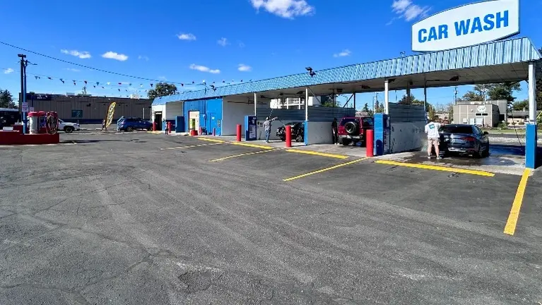 Main exterior view showing the self-service bays and overall facility Main exterior view showing the self-service bays and overall facility