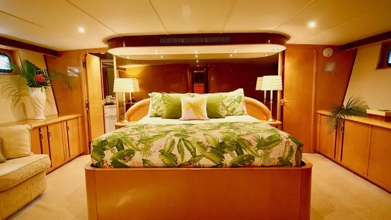 Luxurious full-beam master suite featuring rich wood finishes, abundant storage, and a private ensuite bath. Luxurious full-beam master suite featuring rich wood finishes, abundant storage, and a private ensuite bath.