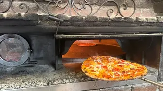 A Restaurant Offering Wood-Fired Pizza & Mediterranean Cuisine