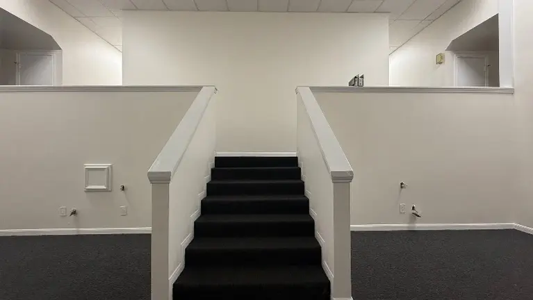 Stairs to 6 offices & conference room Stairs to 6 offices & conference room