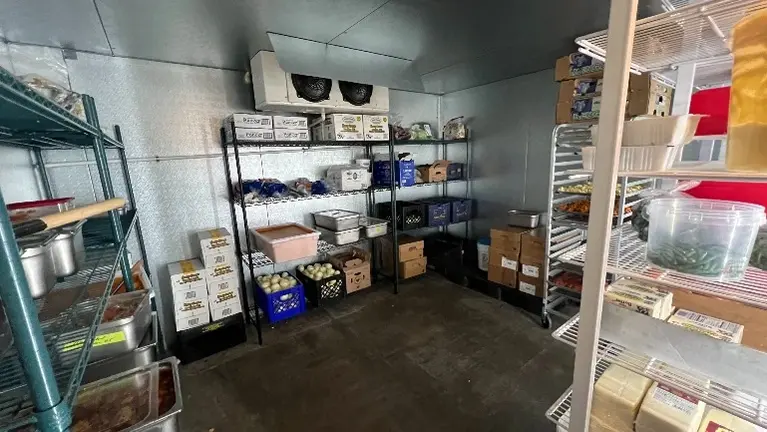 Dedicated dry-storage area with commercial shelving and organized back-of-house space Dedicated dry-storage area with commercial shelving and organized back-of-house space