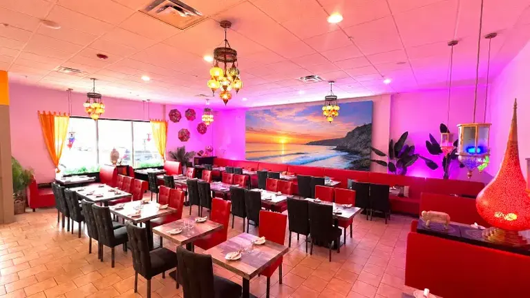 Spacious main dining room with flexible seating layout and large-format video wall Spacious main dining room with flexible seating layout and large-format video wall