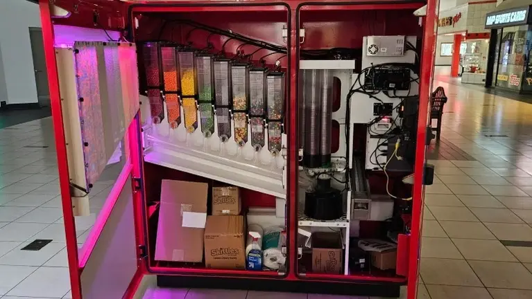 Full interior access showing dispensing and control systems Full interior access showing dispensing and control systems