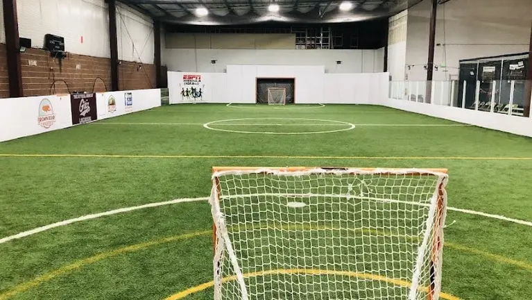 Fully enclosed turf field