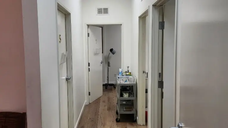 Hallway showing multiple private treatment rooms