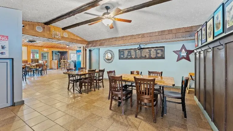 Spacious dining area with flexible seating and event potential