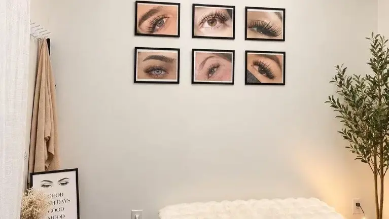 Elegant studio interior featuring a professional lash portfolio display and a welcoming atmosphere for clients.