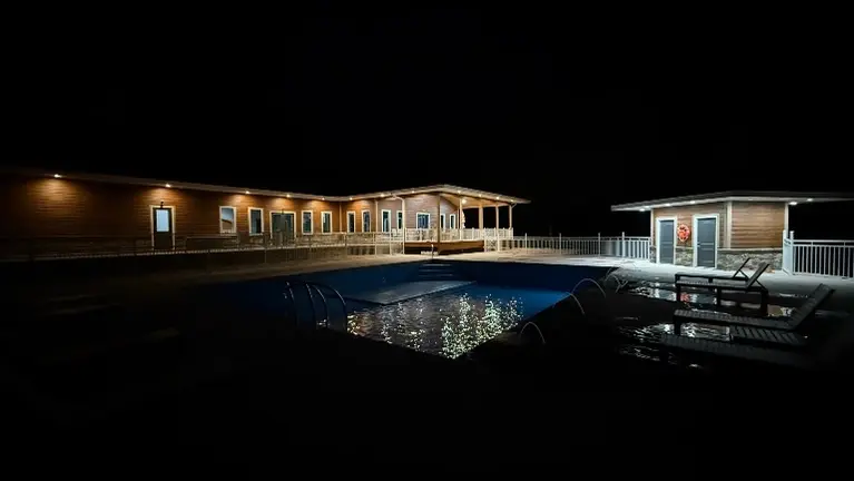 Night time photo of club house Night time photo of club house